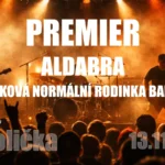 Koncertný plagát skupín Premier, Aldabra a Taková normálna rodinka v DK Polička 13. novembra 2026 s hudobníkmi vystupujúcimi uprostred ohnivých oranžových pódiových svetiel.